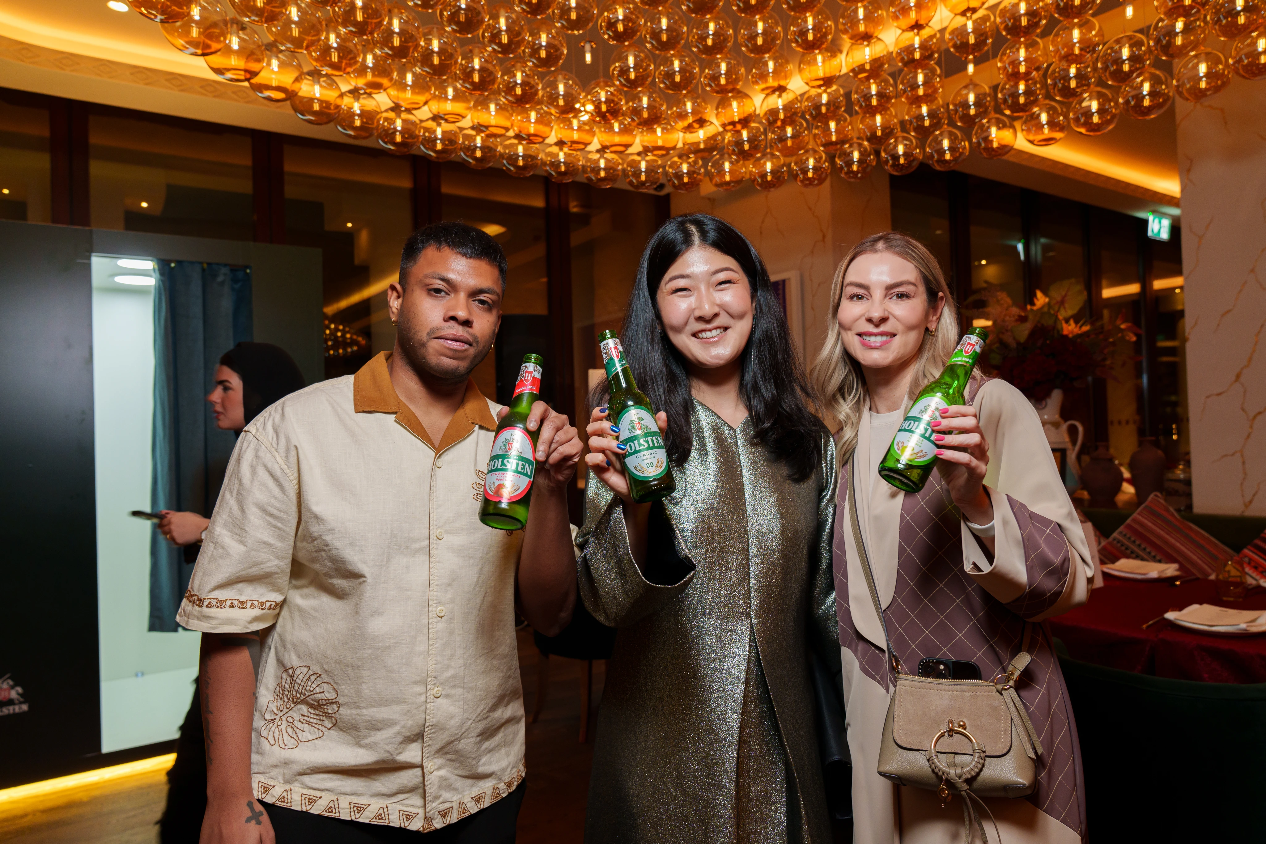 Close-up of Holsten malt drink bottle on a table